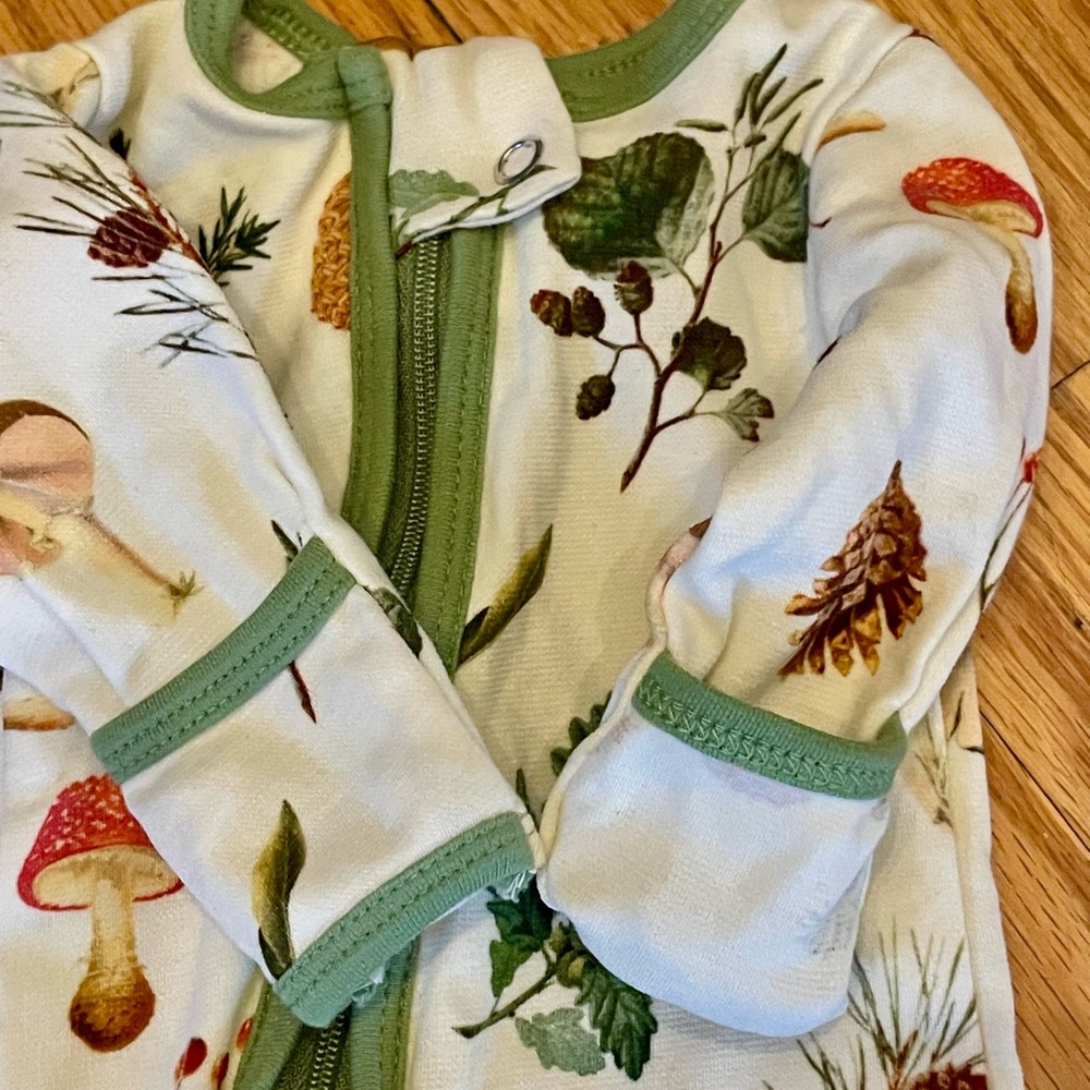Nature-Inspired Baby Onesie with Green Trim